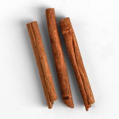 This may contain: two cinnamon sticks next to each other on a white surface